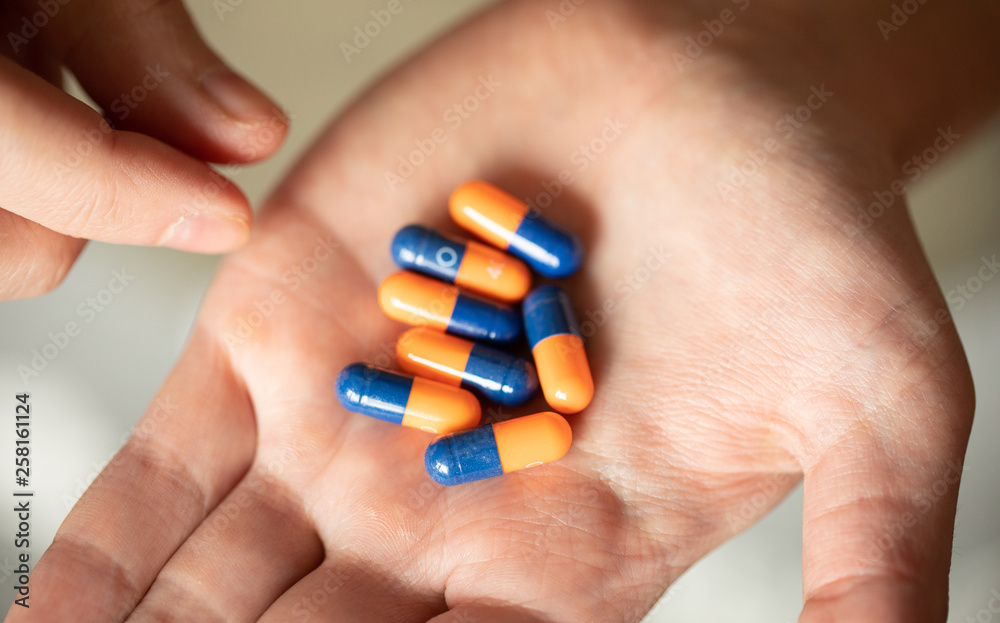Colorful pills and medicines in the hand Colorful pills and medicines in the hand