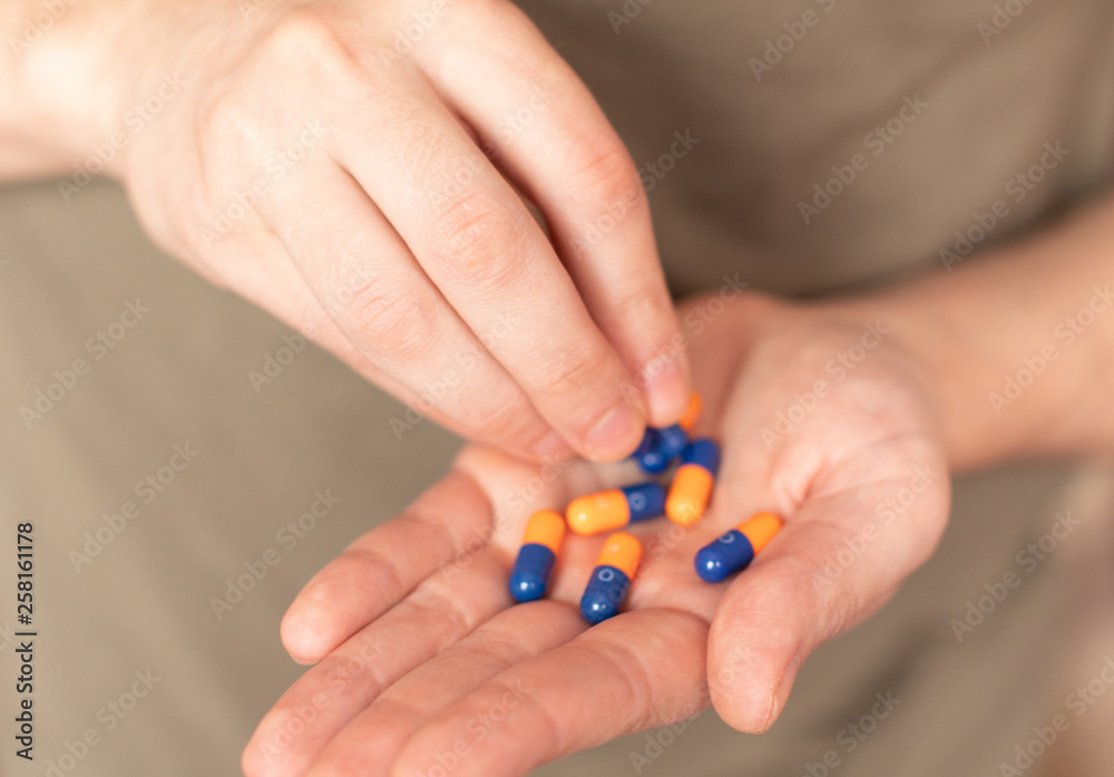 Colorful pills and medicines in the hand 