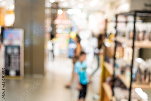 Blurred group of people shopping in supermarket