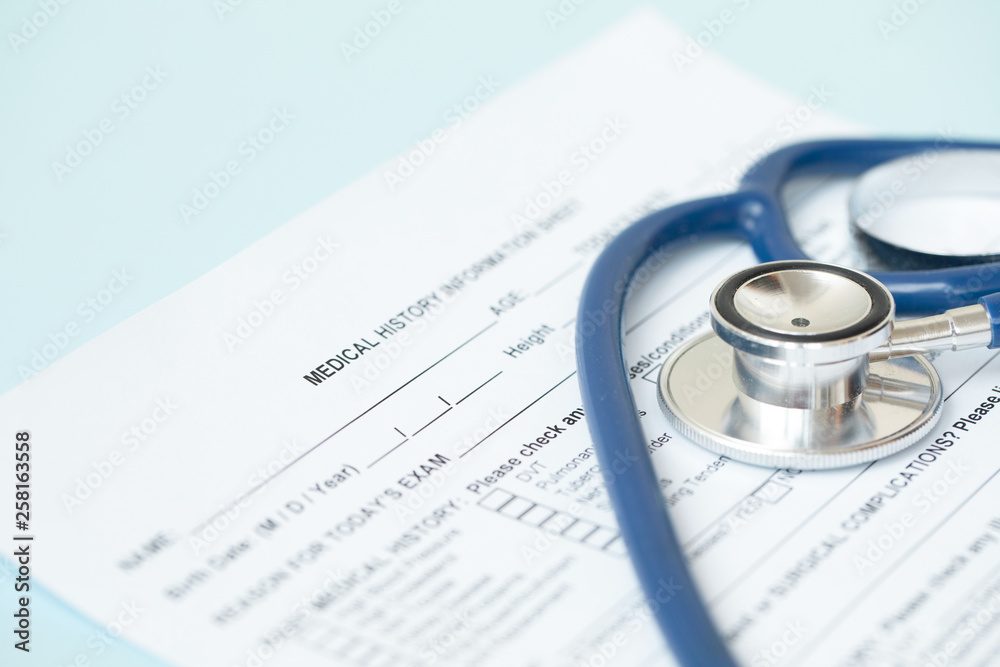 Stethoscope and patient medical history form. Health check diagnostics concept. Stethoscope and patient medical history form. Health check diagnostics concept.