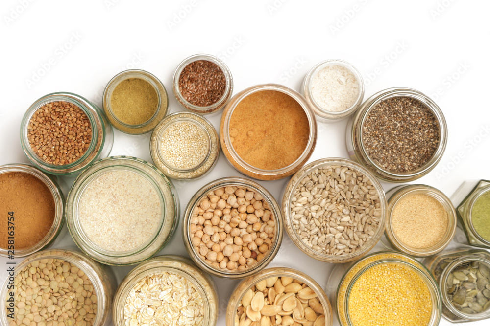 Top view of jars with grains, seeds, legumes, flours and various food ingredients. Healthy food concept. Top view of jars with grains, seeds, legumes, flours and various food ingredients. Healthy food concept.