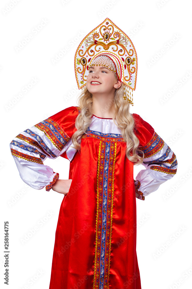 Fototapeta premium Traditional Russian folk costume, portrait of a young beautiful girl
