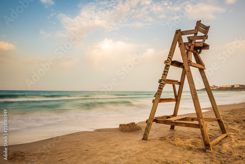 beach watchman ladder on the beach at sunset