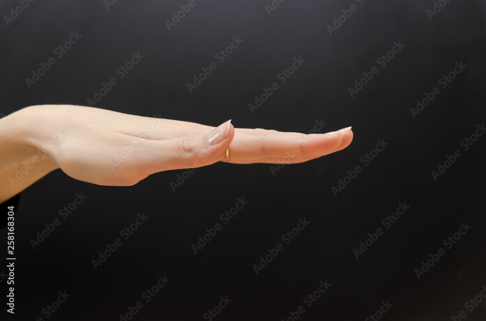 inverted female palm on a black background
