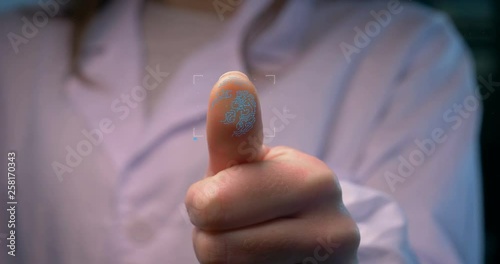 Person accessing a hologram with a fingerprint. Man, access to a modern hologram of a personal database with the discovery of fingerprint identification. Concept: Science, Car, Hologram, Viruses, DNA.