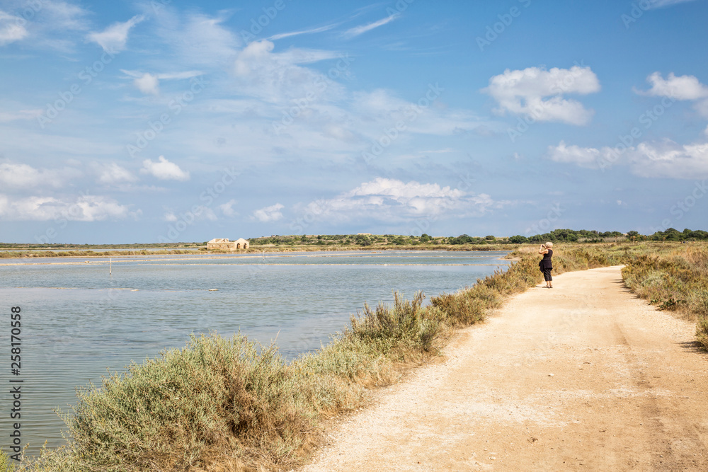 Italy, Sicily, senior woman in Vendicari nature reserve Italy, Sicily, senior woman in Vendicari nature reserve