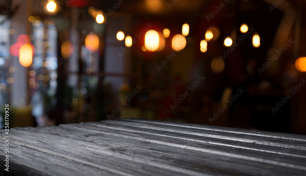 blurred background of bar and dark brown desk space of retro wood blurred background of bar and dark brown desk space of retro wood