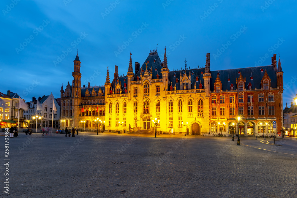 Provincial Court building on market square (Grote markt) at night, Bruges, Belgium