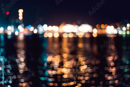the seaport lights are out of focus. seawater reflection