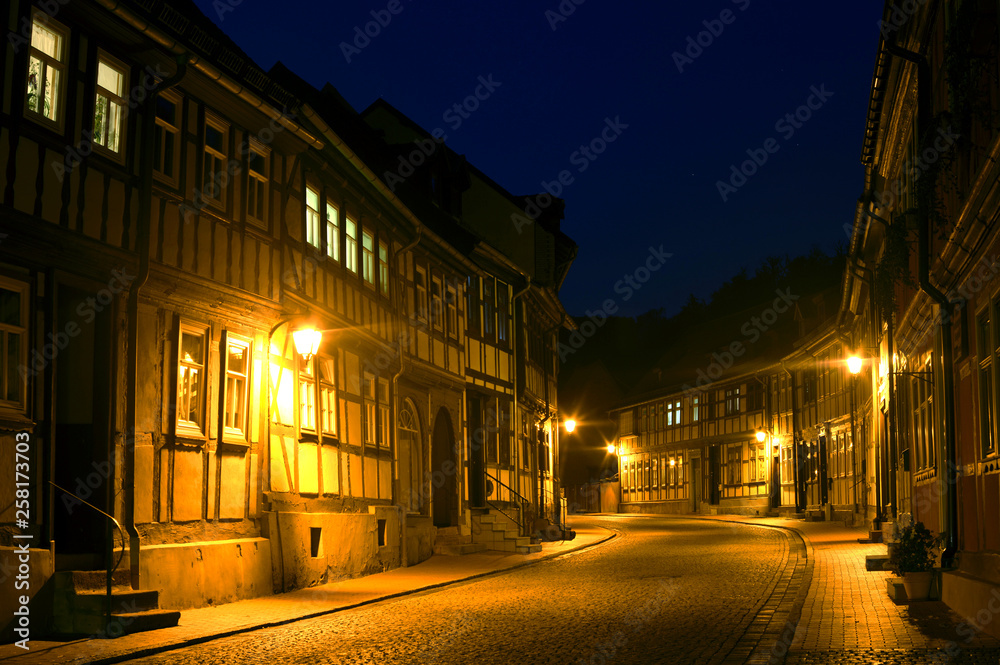Old town in Stolberg, Harz, Germany, during night with no cars and traditional half-timbered houses