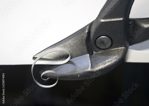 scissors cut white metal close-up