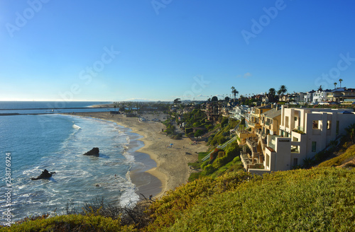 Scenic view over a beach in Corona del Mar, near Los Angeles, california, with the pacific ocean and real estates with ocean view