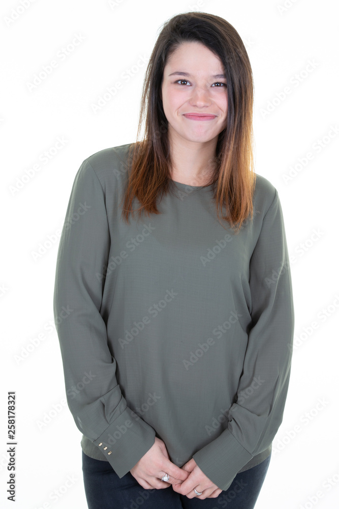 Young cheerful happy girl smiling laughing looking at camera over white background Young cheerful happy girl smiling laughing looking at camera over white background