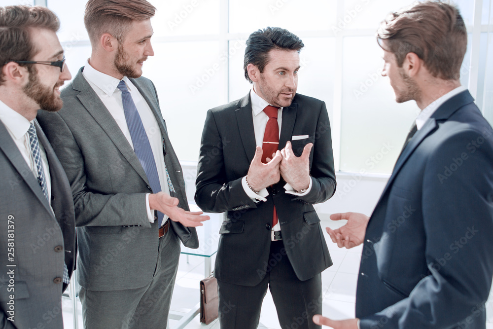 business team communicates standing in the office business team communicates standing in the office