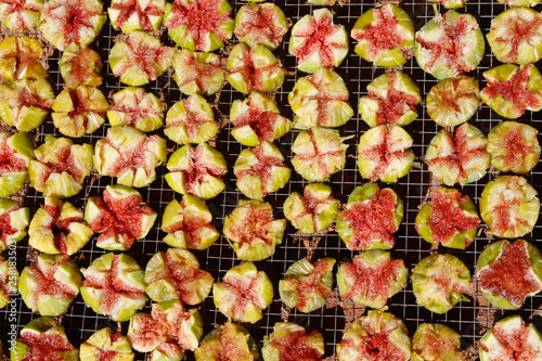 Fig fruits drying to the sun during collect season early summer in the Spanish Mediterranean island of Mallorca