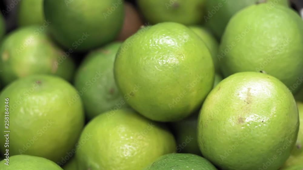 ripe green citrus fruit lime close-up on the market counter ripe green citrus fruit lime close-up on the market counter