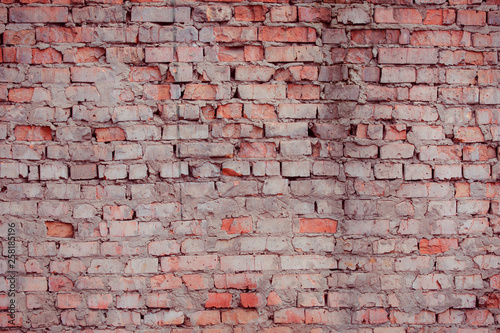 Old textured brick wall with natural defects. Scratches, cracks, crevices, chips, dust, roughness. Can be used as background for design or poster.