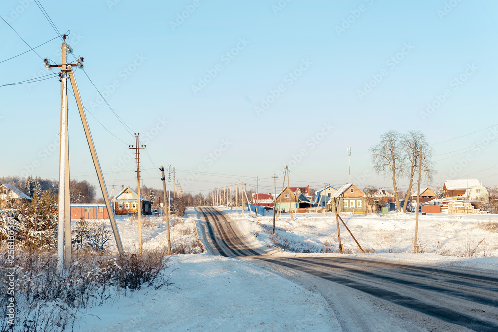 Russian winter village, snow, sun, the central part of Russia Russian winter village, snow, sun, the central part of Russia