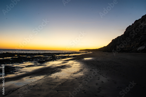  Beach overlooking the cliff  colors  blue  orange  yellow  black   white shades.