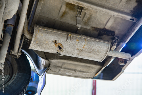 Old car muffler with shallow depth of field