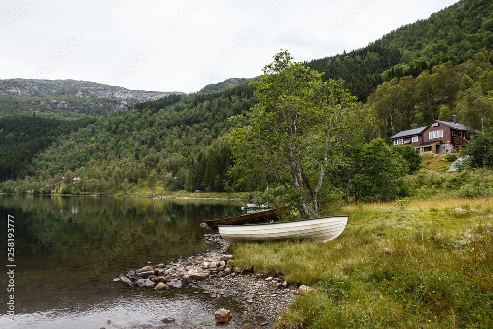 Fototapeta premium View of a Norwegian lake with a boat