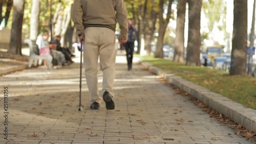 Wallpaper Mural Lonely, Old, Person Walking Down Street With Stick, Limping. Gait, Legs Disease Torontodigital.ca