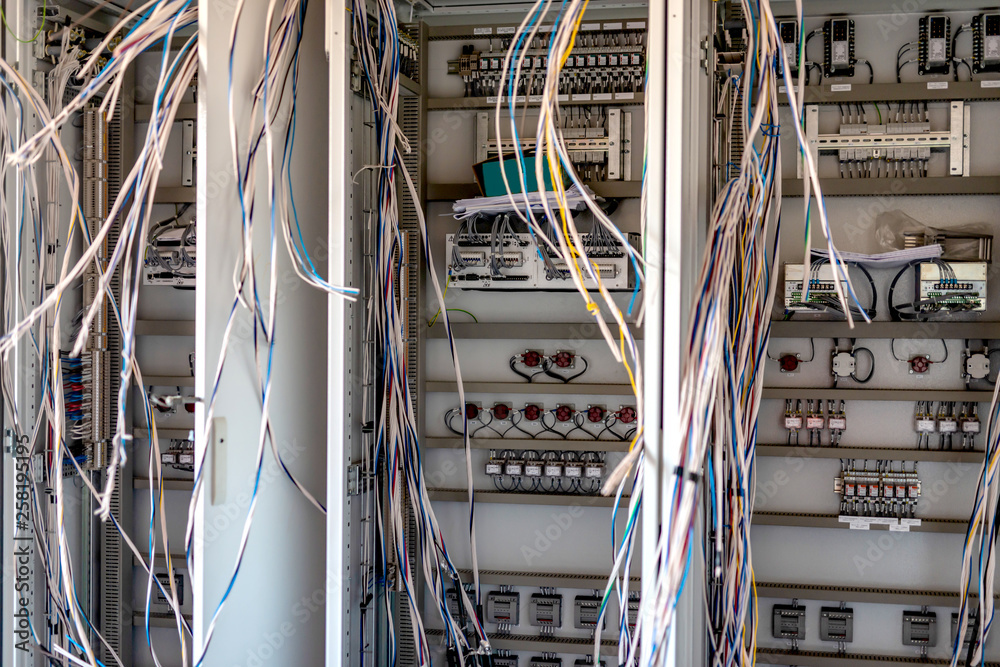 Relay hall with a variety of wires in the process of installation Relay hall with a variety of wires in the process of installation