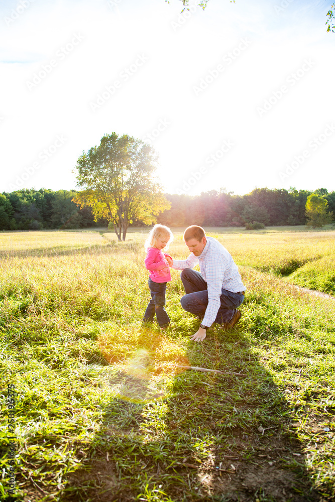 Father and daughter in field Father and daughter in field
