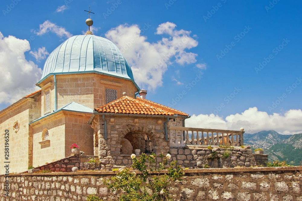 Obraz premium Religious architecture. Ancient Church of Our Lady of the Rocks ( Gospa od Skrpjela ) on sunny summer day. Montenegro