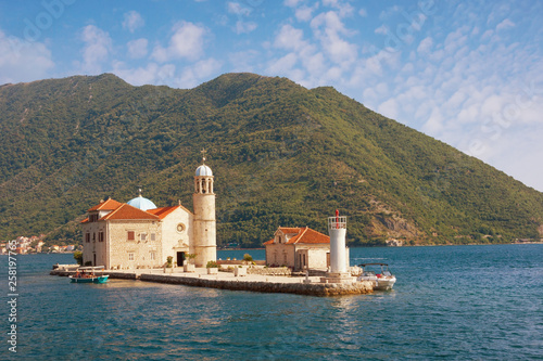 View of Island of Our Lady of the Rocks ( Gospa od Skrpjela ) on sunny summer day. Montenegro,  Adriatic Sea, Bay of Kotor, Perast