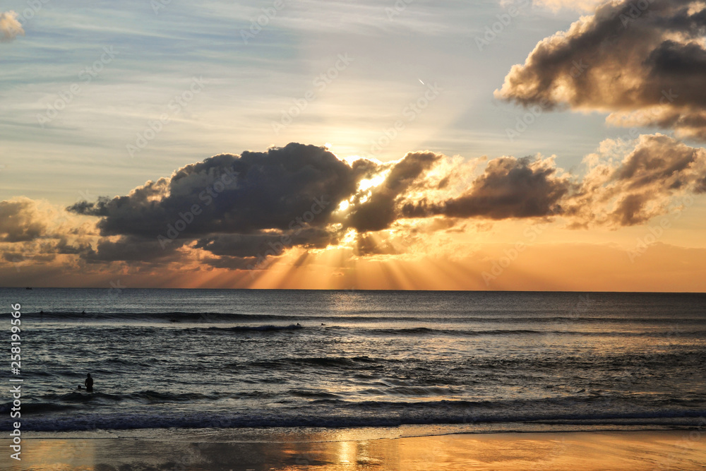 Obraz premium Indian Ocean. Bali. Indonesia. Sunset over the ocean. Waves for surf