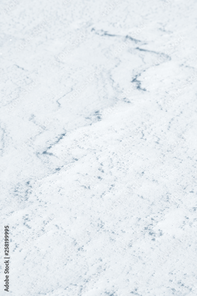 Fresh snow background texture. Winter background with snowflakes and snow mounds. Snow lumps.