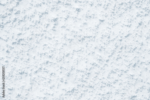 Fresh snow background texture. Winter background with snowflakes and snow mounds. Snow lumps.