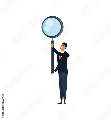 young businessman with magnifying glass