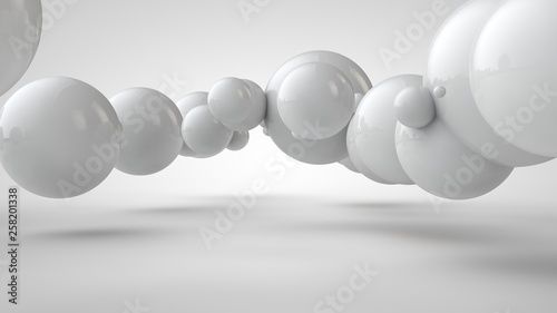 3D illustration of balls of different sizes hanging in space. The idea of order, chaos and harmony. Abstraction. Comparative image of the geometry of space. 3D rendering isolated on white background.