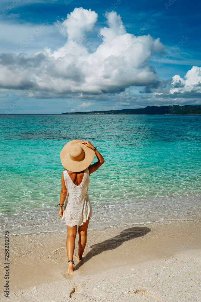Girl on a tropical beach with hat. Philippines, Boracay
