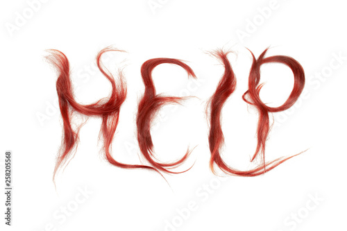 Word "Help" made by red hair. Haircare concept.