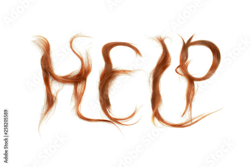 Word "Help" made by red hair. Haircare concept.