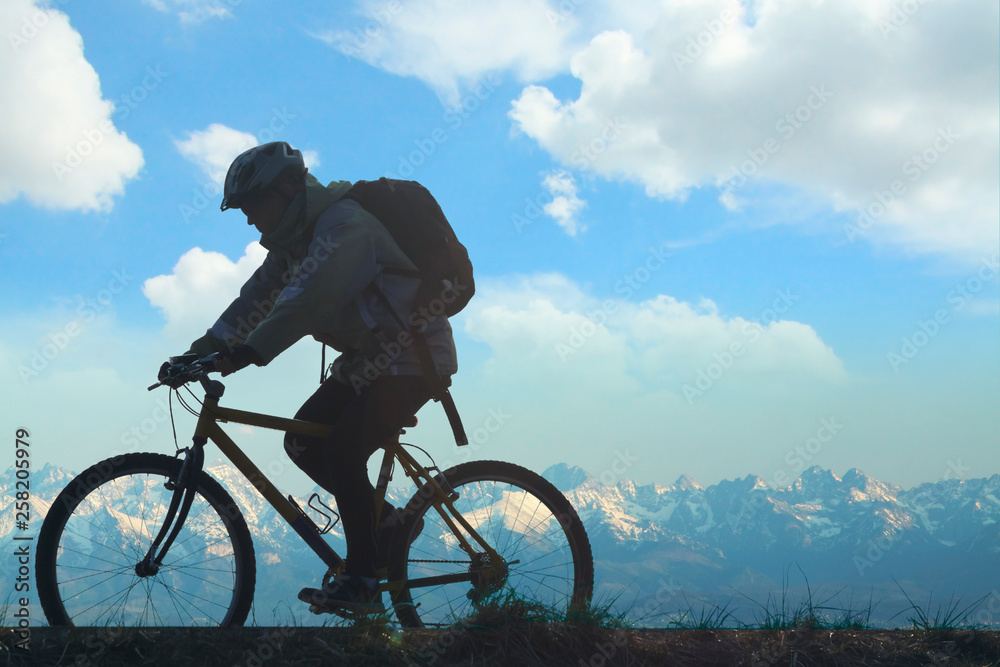Cyclist against Mountain Landscape