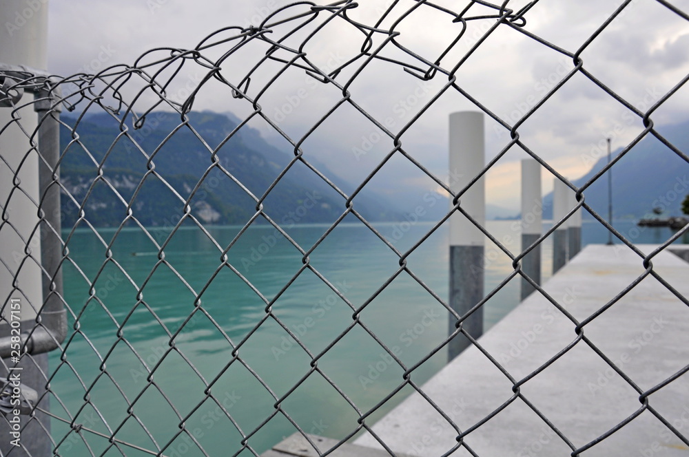 Steel fences around the sea pier, background Steel fences around the sea pier, background