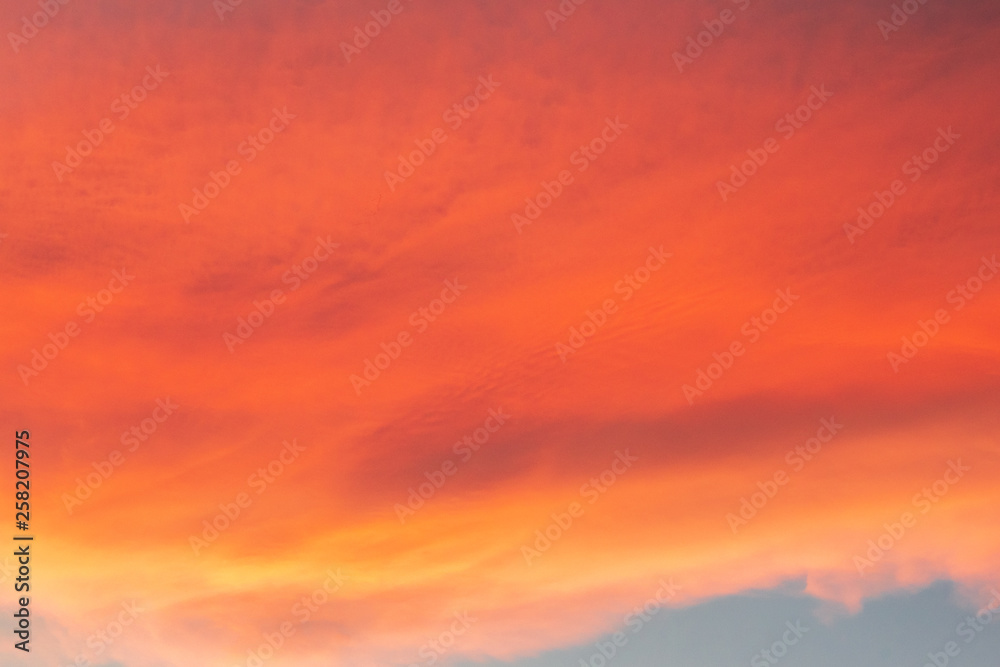Reddish clouds at sunset over mountains