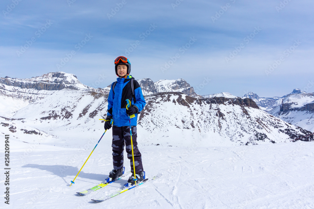 Young Skier on Mountain Edge at Lake Louise in the Canadian Rockies Young Skier on Mountain Edge at Lake Louise in the Canadian Rockies