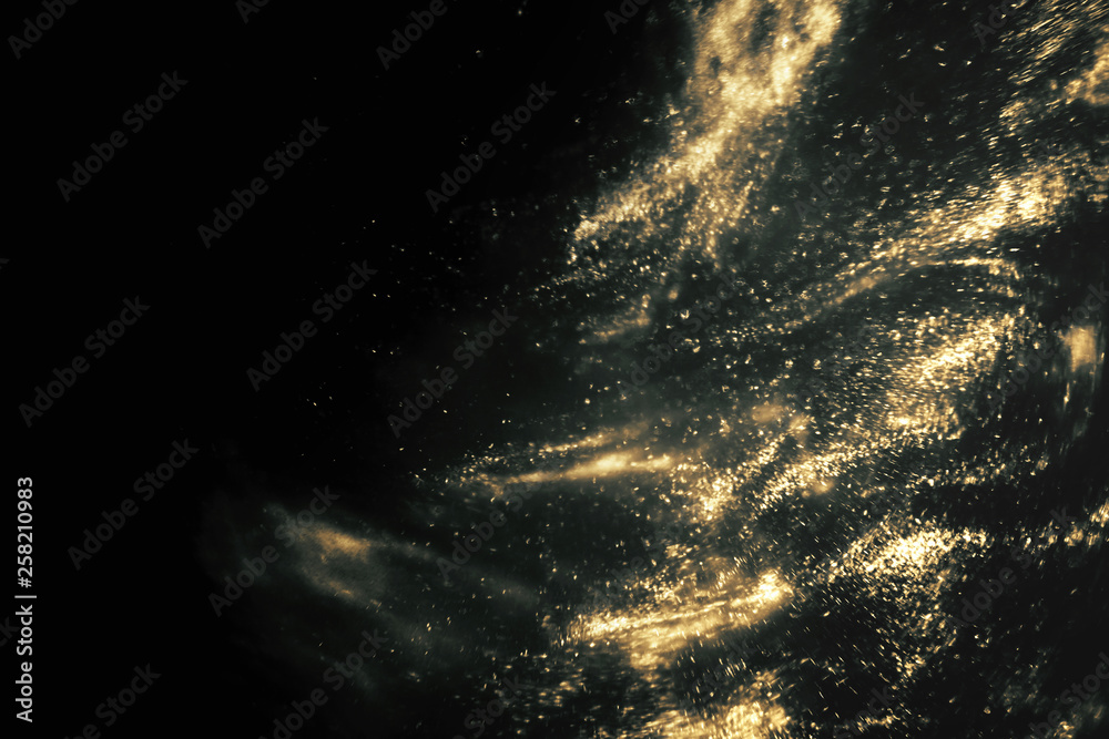 Fototapeta premium Abstract black and gold festive glitter shimmering magic luxury background with copy space. de-focused
