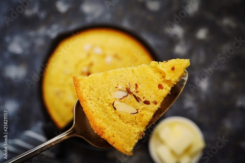 Sliced piece of corn bread close up, selective focus