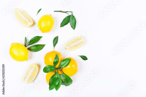 Lemon, orange, mandarin with leaves isolated on white background. Flat lay, top view. Fruit composition