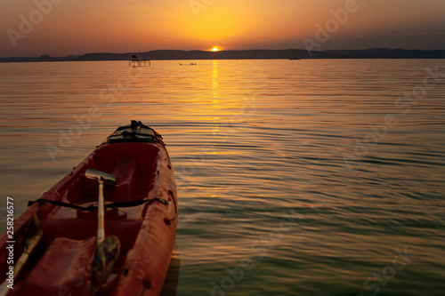 Lake Balaton at sunset with a kayak in the foreground