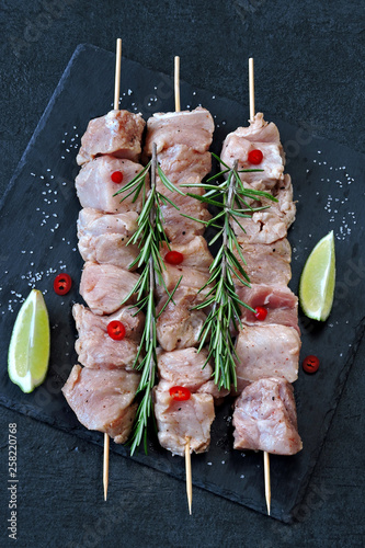 Raw kebabs with spices. Cooking kebabs. Keto diet.