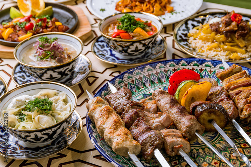 dishes of Uzbek cuisine lagman, pilaf, skewers photo