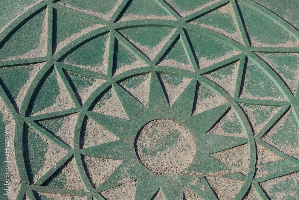 green metal texture of pattern and sand on an iron wall