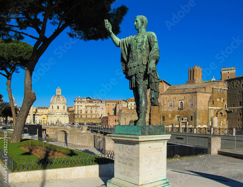 Bronze statue of S.P.Q.R. IMP. CAESARI NERVAE Augustus on Imperial Forums Street (Via dei Fori Imperiali)  Rome, Italy - January 2012. photo
